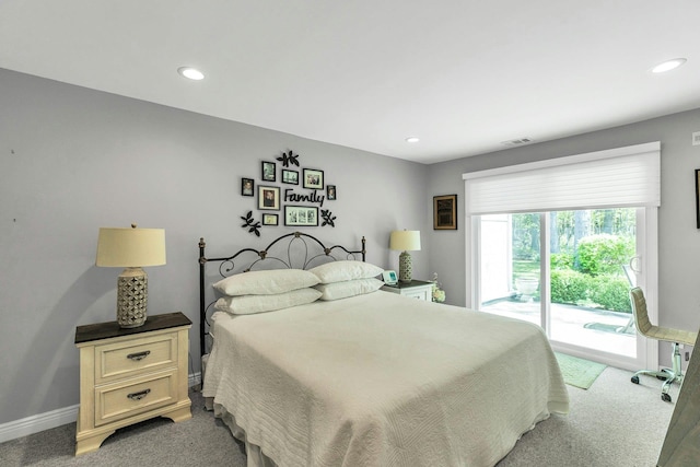 bedroom with light colored carpet, access to exterior, recessed lighting, and baseboards