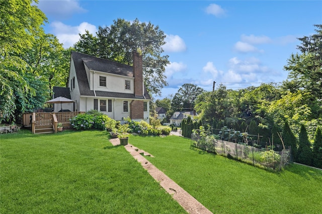 21 Judson Ave, Ardsley, NY 10502 - view of front of home featuring a chimney, a deck, a front yard, and roof with shingles