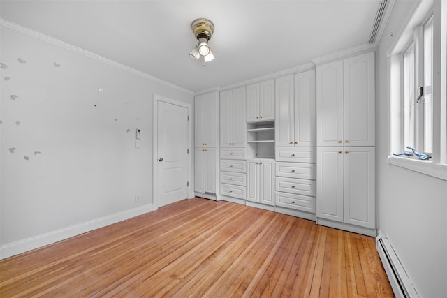 15 Scanlon Ave, Florida, NY 10921 - unfurnished bedroom with baseboard heating, light wood finished floors, ornamental molding, baseboards, and a closet
