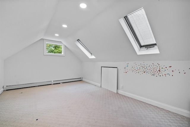 15 Scanlon Ave, Florida, NY 10921 - additional living space featuring a skylight, a baseboard heating unit, lofted ceiling, baseboards, and carpet flooring
