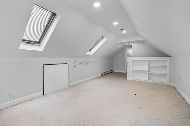 15 Scanlon Ave, Florida, NY 10921 - additional living space with a skylight, a baseboard heating unit, light colored carpet, lofted ceiling, and baseboards