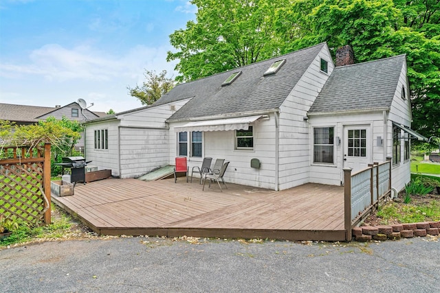 15 Scanlon Ave, Florida, NY 10921 - back of property featuring roof with shingles, a deck, and a chimney