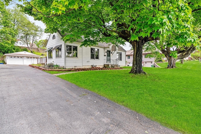 15 Scanlon Ave, Florida, NY 10921 - view of property hidden behind natural elements featuring an outdoor structure, a garage, and a front lawn