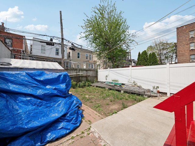 fenced backyard with a patio