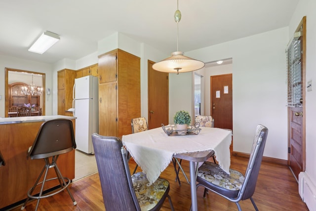 60 Rte 210, Stony Point, NY 10980 - dining room featuring wood finished floors, a chandelier, and baseboards