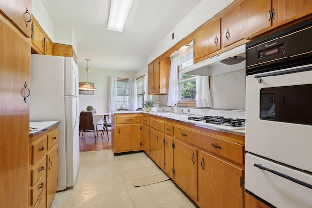 60 Rte 210, Stony Point, NY 10980 - kitchen with a warming drawer, white appliances, light flooring, light countertops, and a sink