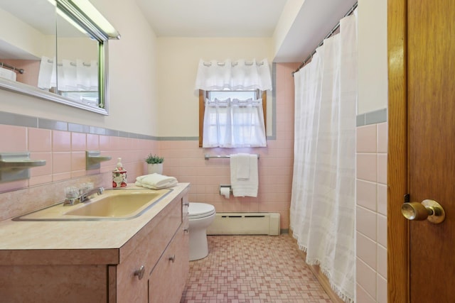 60 Rte 210, Stony Point, NY 10980 - full bath featuring a baseboard radiator, toilet, tile walls, vanity, and tile patterned floors