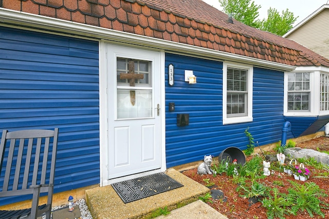 133 Spring Ln, Levittown, NY 11756 - entrance to property with a tiled roof