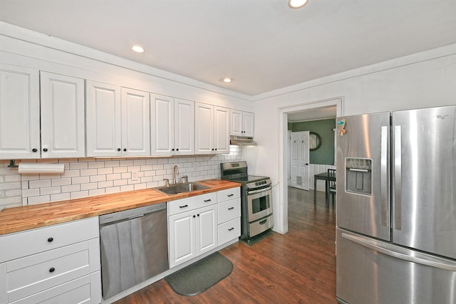 133 Spring Ln, Levittown, NY 11756 - kitchen featuring stainless steel appliances, a sink, wood counters, under cabinet range hood, and dark wood finished floors