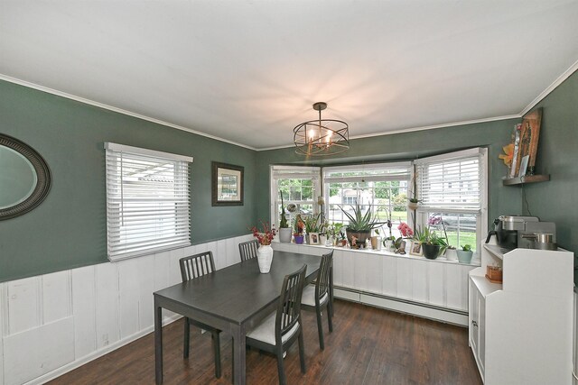 133 Spring Ln, Levittown, NY 11756 - dining area with baseboard heating, crown molding, plenty of natural light, a chandelier, and wood finished floors