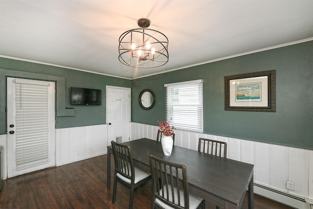 133 Spring Ln, Levittown, NY 11756 - dining area with baseboard heating, crown molding, a chandelier, wainscoting, and wood finished floors