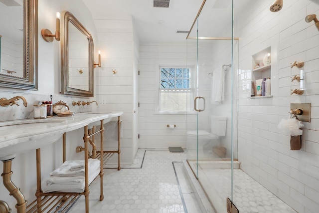 5 Donald Dr, Hastings-On-Hudson, NY 10706 - bathroom featuring a stall shower, tile walls, and tile patterned flooring