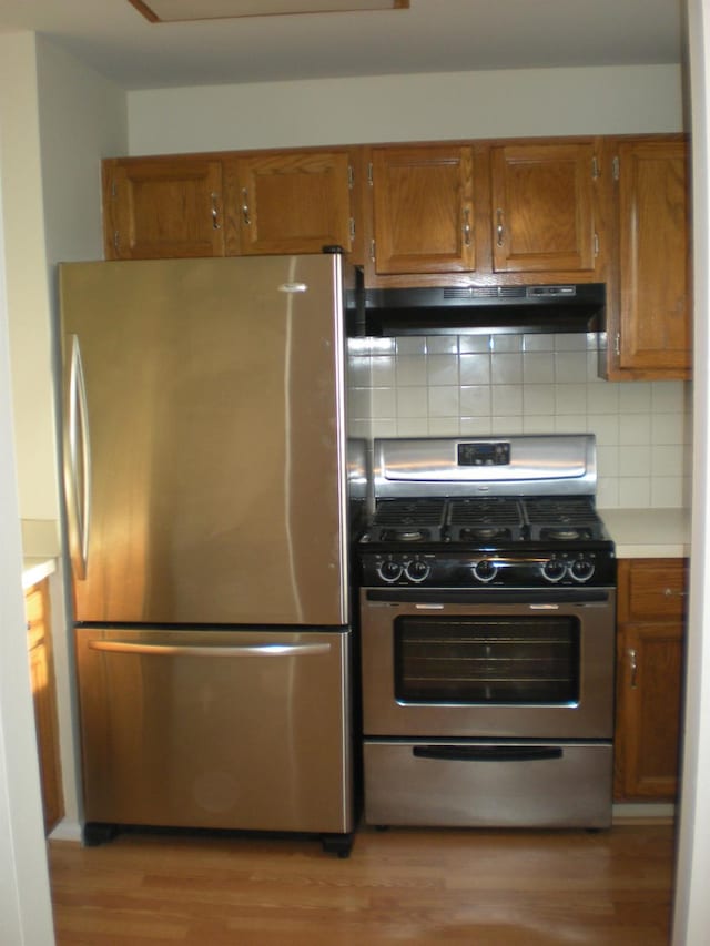 2 Lexington Hl Unit 10, Harriman, NY 10926 - kitchen with appliances with stainless steel finishes, under cabinet range hood, and brown cabinets