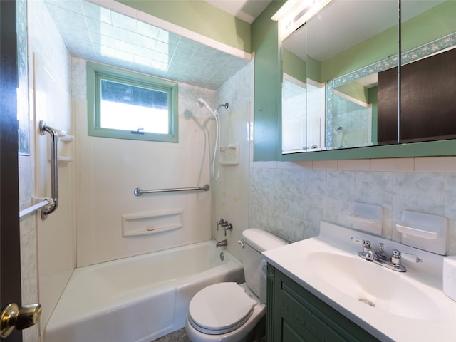 61 Reinhardt Rd, Middletown, NY 10940 - bathroom featuring tile walls, washtub / shower combination, toilet, and vanity
