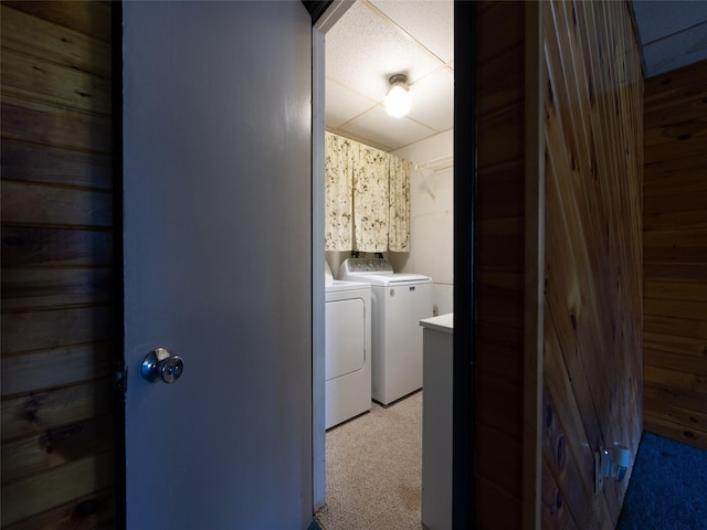61 Reinhardt Rd, Middletown, NY 10940 - clothes washing area with independent washer and dryer, light colored carpet, and wooden walls