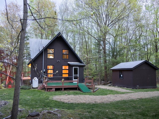 61 Reinhardt Rd, Middletown, NY 10940 - back of property featuring a wooden deck, a yard, and an outbuilding