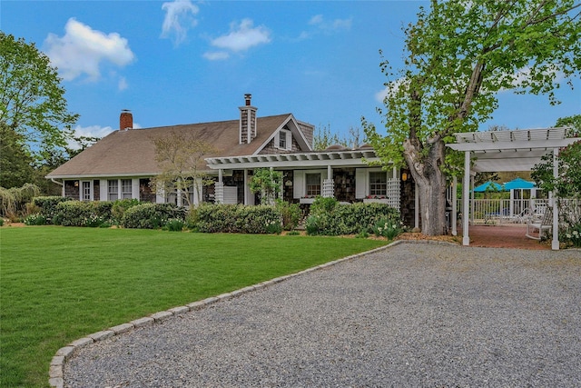 5A/5B Jessup Ln, Quogue, NY 11959 - shingle-style home with a pergola and a front lawn