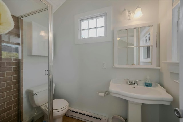5A/5B Jessup Ln, Quogue, NY 11959 - bathroom featuring baseboard heating, toilet, a sink, and a shower with door