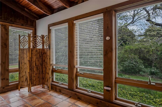 5A/5B Jessup Ln, Quogue, NY 11959 - doorway to outside with wood ceiling, wood walls, and tile patterned floors