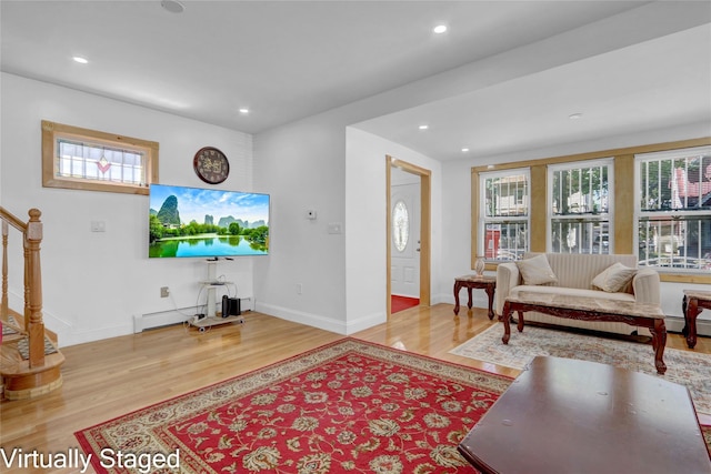 11511 173rd St, Addisleigh Park, NY 11434 - living room with plenty of natural light, wood finished floors, stairs, and recessed lighting