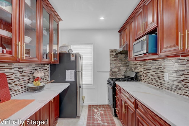 11511 173rd St, Addisleigh Park, NY 11434 - kitchen with stainless steel appliances, light stone counters, backsplash, under cabinet range hood, and recessed lighting