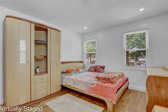 11511 173rd St, Addisleigh Park, NY 11434 - bedroom with multiple windows, light wood-type flooring, recessed lighting, and baseboards
