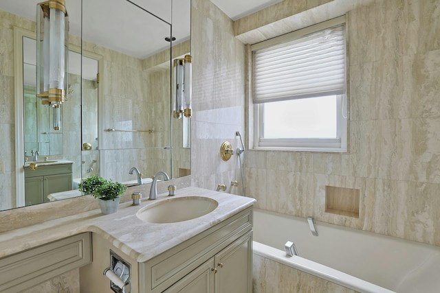 3333 Henry Hudson Pkwy # 23Ef, Bronx, NY 10463 - bathroom featuring vanity, a relaxing tiled tub, a tile shower, and tile walls