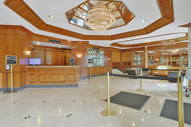 3333 Henry Hudson Pkwy # 23Ef, Bronx, NY 10463 - misc room featuring wooden walls, a raised ceiling, a chandelier, recessed lighting, and marble tiled flooring