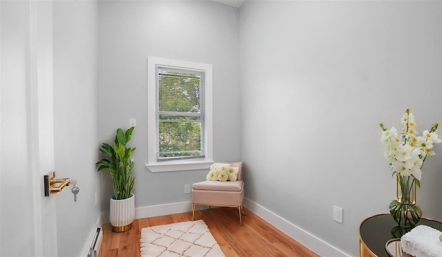 504 Van Nest, Bronx, NY 10460 - sitting room featuring wood finished floors, a baseboard heating unit, and baseboards