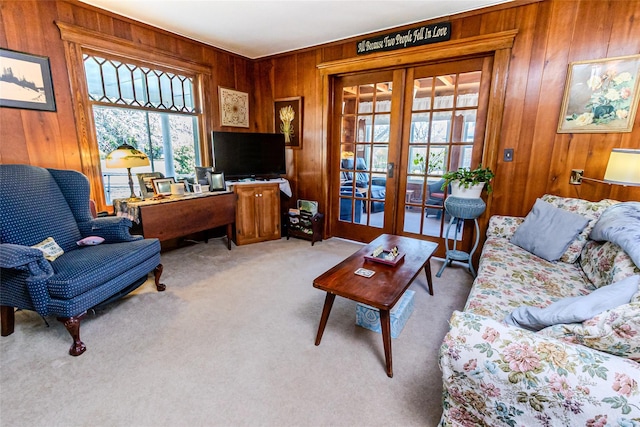 630 New Suffolk Rd, Cutchogue, NY 11935 - living area with french doors, wooden walls, light colored carpet, and a desk
