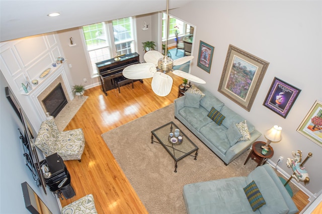 42 Kimberly Dr Unit 42, Westhampton, NY 11977 - living area with wood finished floors, baseboards, and a tile fireplace