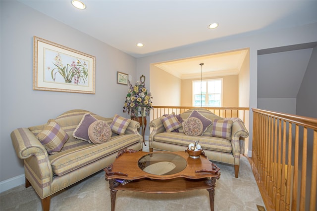 42 Kimberly Dr Unit 42, Westhampton, NY 11977 - living room featuring carpet, crown molding, recessed lighting, and a chandelier