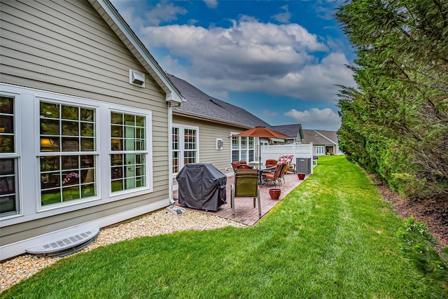 42 Kimberly Dr Unit 42, Westhampton, NY 11977 - rear view of house with a patio and a lawn