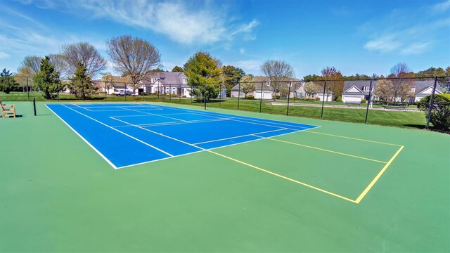 42 Kimberly Dr Unit 42, Westhampton, NY 11977 - view of tennis court with fence, community basketball court, and a residential view