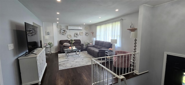 living room featuring a wall unit AC, wood finished floors, and recessed lighting