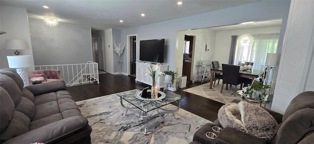 living room featuring wood finished floors, recessed lighting, and a chandelier