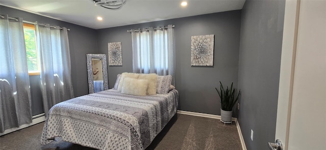 carpeted bedroom with baseboards, recessed lighting, and a baseboard radiator