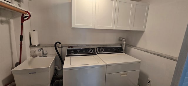 laundry area featuring separate washer and dryer and cabinet space
