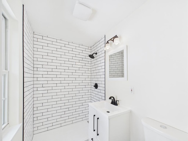 full bath featuring a shower stall, toilet, and vanity
