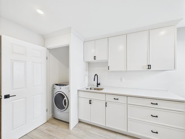 clothes washing area featuring washer / clothes dryer and recessed lighting