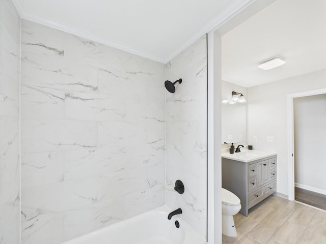 bathroom with vanity, toilet, shower / washtub combination, crown molding, and baseboards