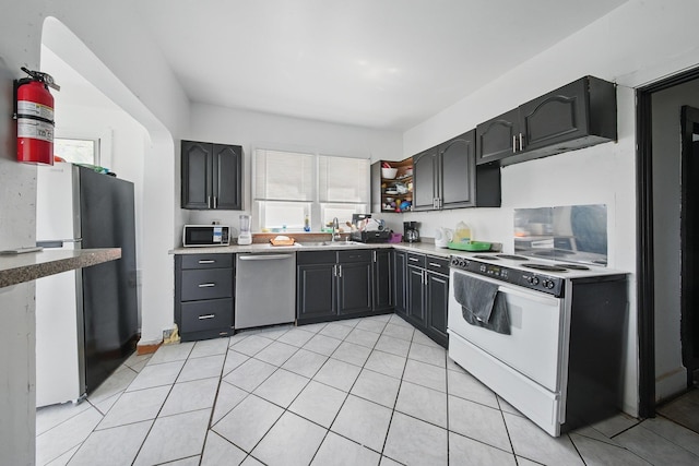 5404 State Route 55, Liberty, NY 12754 - kitchen with stainless steel appliances, healthy amount of natural light, light tile patterned floors, and light countertops