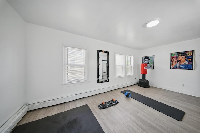 5404 State Route 55, Liberty, NY 12754 - exercise area with baseboard heating, baseboards, and wood finished floors