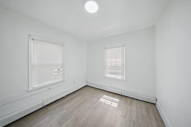 5404 State Route 55, Liberty, NY 12754 - empty room featuring a baseboard radiator, wood finished floors, and baseboards