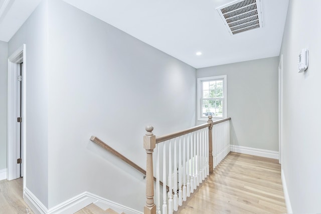 223 Townline Rd, Commack, NY 11725 - stairway with wood finished floors, baseboards, and recessed lighting