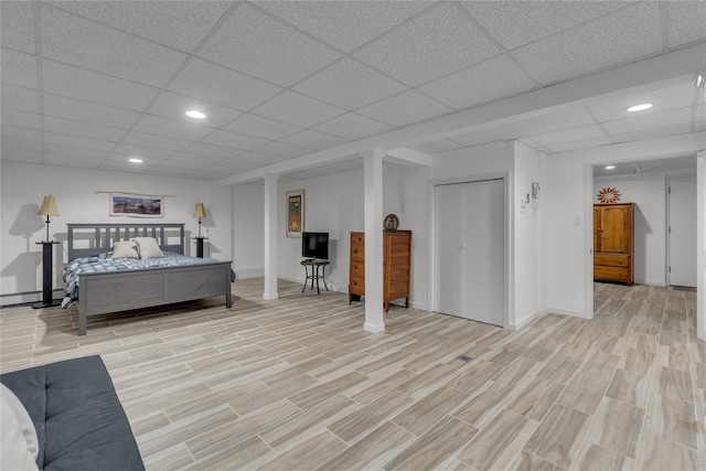 10 Bay Dr W, Huntington Bay, NY 11743 - bedroom featuring a paneled ceiling, light wood-type flooring, baseboards, and recessed lighting