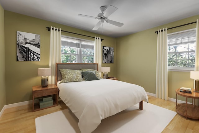 10 Bay Dr W, Huntington Bay, NY 11743 - bedroom with multiple windows, light wood-style flooring, and a ceiling fan