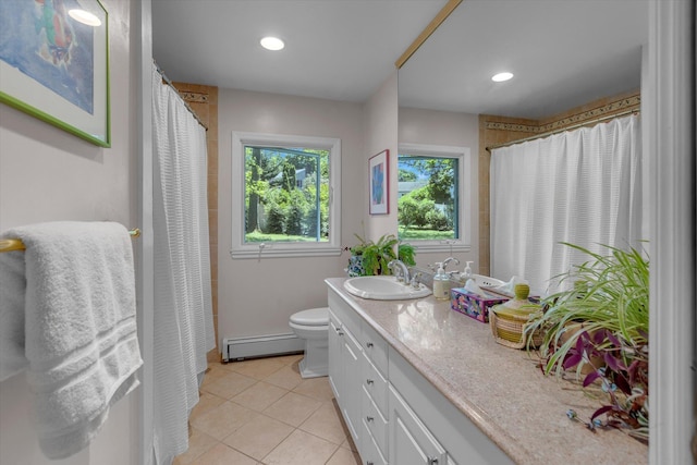 10 Bay Dr W, Huntington Bay, NY 11743 - bathroom featuring a baseboard heating unit, vanity, tile patterned floors, toilet, and recessed lighting