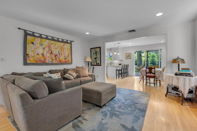 10 Bay Dr W, Huntington Bay, NY 11743 - living room featuring light wood finished floors and recessed lighting