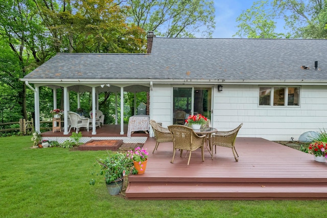 10 Bay Dr W, Huntington Bay, NY 11743 - wooden deck with a lawn and outdoor dining area
